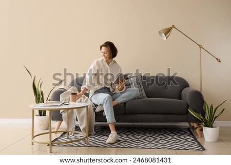 Similar – Image, Stock Photo Woman drinking coffee and on the mobile phone in airport