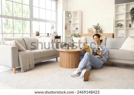 Similar – Image, Stock Photo Woman at home relaxing on sofa couch using social media on phone for video chatting with her loved ones during corona virus pandemic. Stay at home, social distancing lifestyle.