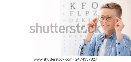 Similar – Image, Stock Photo child wearing glasses and writing while being really concentrated