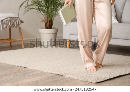 Image, Stock Photo Barefoot woman standing on beach at sunset