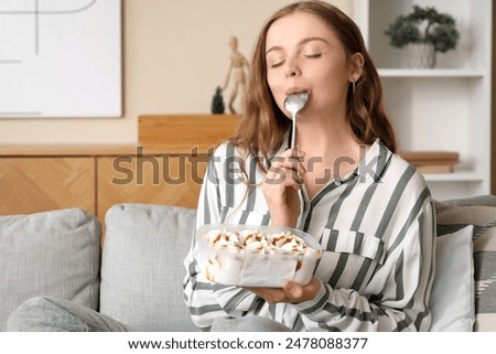 Similar – Image, Stock Photo Cool female eating ice cream on beach