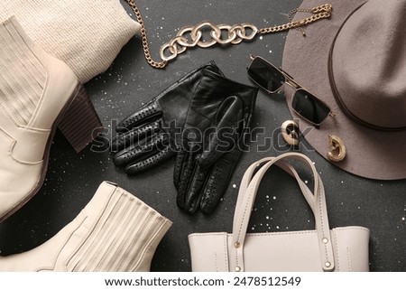Similar – Image, Stock Photo Women fashion composition. Warm winter female woollen knitted sweaters, pullovers stack on a wooden stool at white background. Modern clothes concept for magazine, blog, social media.