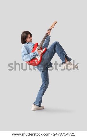 Image, Stock Photo Woman playing guitar in field with dry vegetation