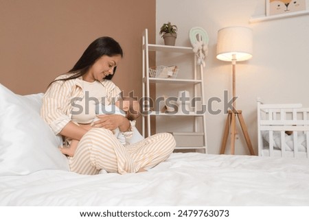 Similar – Image, Stock Photo Mother feeding baby at home