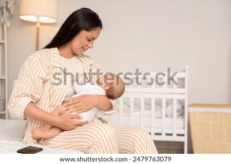 Similar – Image, Stock Photo Mom breastfeeding at home