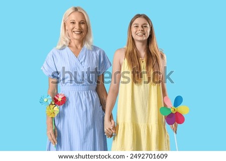 Similar – Image, Stock Photo Mother with her daughter at beach