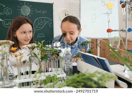 Similar – Image, Stock Photo teenager looks through a magnifying glass and pulls up her nostrils