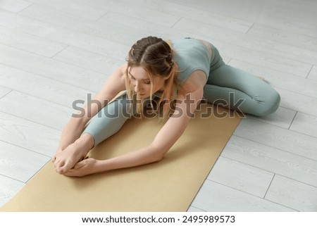 Similar – Image, Stock Photo Flexible woman doing yoga on paddleboard