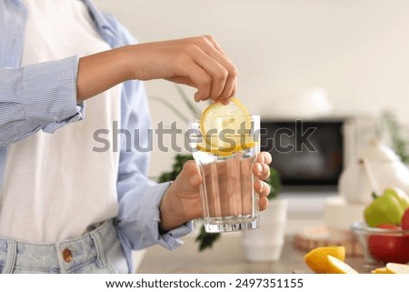 Similar – Image, Stock Photo Tasty infused water in bottle with drinking straw and ingredients: lime, strawberry and mint leaves at white background