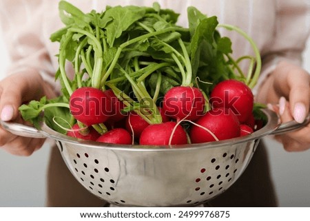 Image, Stock Photo Female hand with radish in hand in a fruit shop