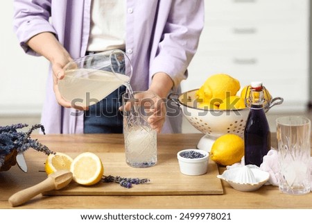 Similar – Image, Stock Photo Woman pouring cocktail in metal mug