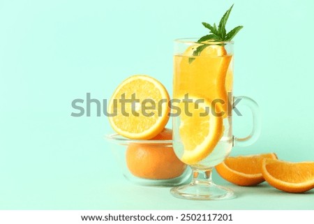 Similar – Image, Stock Photo Tasty infused water in bottle with drinking straw and ingredients: lime, strawberry and mint leaves at white background