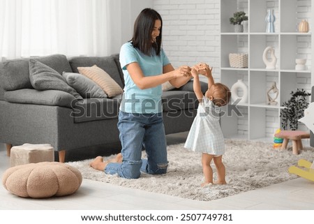 Similar – Image, Stock Photo Adult daughter teaching her elderly mother to use laptop