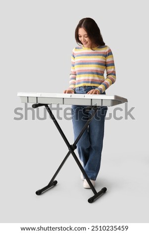 Similar – Image, Stock Photo Woman with modern synthesizer at home