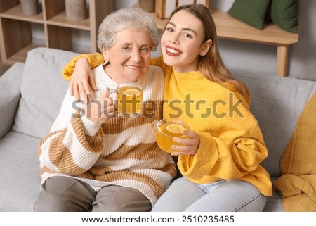 Similar – Image, Stock Photo Young woman with her dog French Bulldog giving him water to refresh after a walk, portrait image. Pet concept. Taking care of the man best friend. Woman taking his dog to a walk during a sunny day