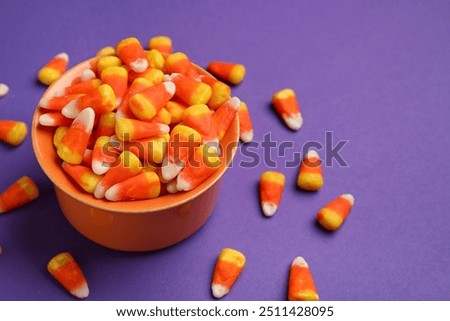 Similar – Image, Stock Photo Many colorful candies fall down in front of a black background