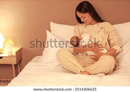 Similar – Image, Stock Photo Mom breastfeeding at home