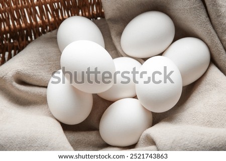 Similar – Image, Stock Photo Chicken eggs on napkin on wooden table