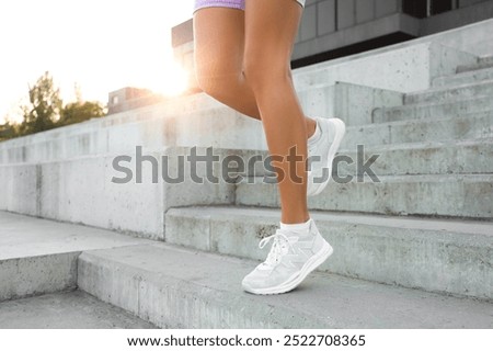 Similar – Image, Stock Photo Sporty young woman in a urban city area