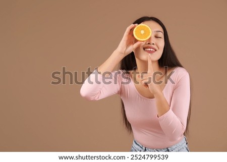 Similar – Image, Stock Photo Woman showing half orange over bowl