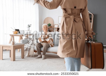 Similar – Image, Stock Photo Woman visiting her grandmother in isolation during a coronavirus pandemic