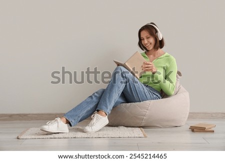 Image, Stock Photo Girl Reading Book in Train