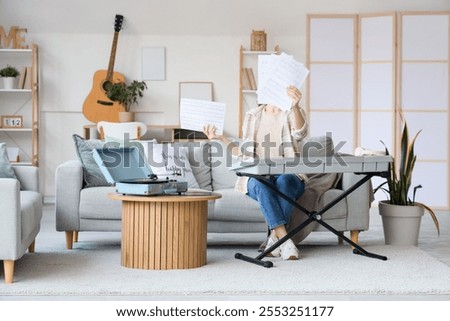 Image, Stock Photo Woman with modern synthesizer at home