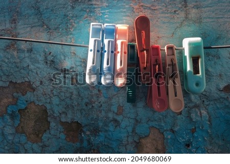 Similar – Image, Stock Photo colored plastic clothespins illuminated