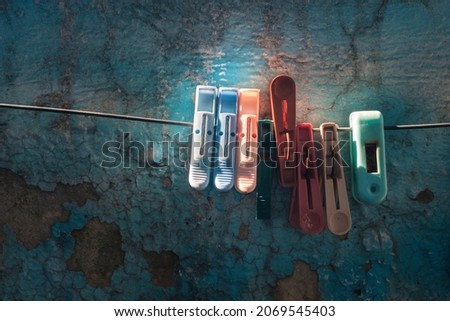 Similar – Image, Stock Photo colored plastic clothespins illuminated