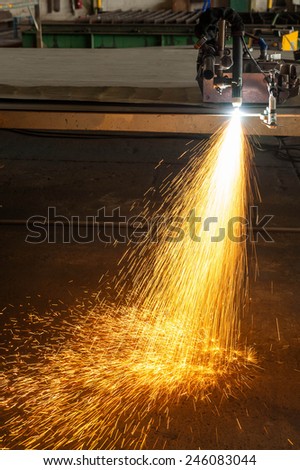 metal cutting with plasma torch close-up on low ligth