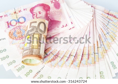 EURO currency on over the China yuan banknote