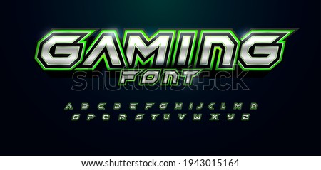 Gaming font for video game logo and headline. Bold futuristic letters with sharp angles and green outline. Tilted sharp font on black background. Modern Vector typography design with metal texture.