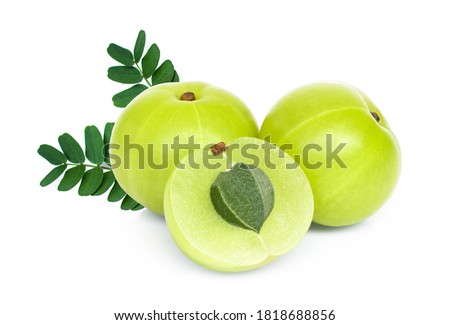 Indian gooseberry fruits or Amla ( phyllanthus emblica ) with green leaves and slice isolated on white background. macro