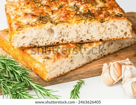 Similar – Foto Bild Hausgemachtes Rosmarin-Focaccia-Brot, Ansicht von oben, Nahaufnahme.