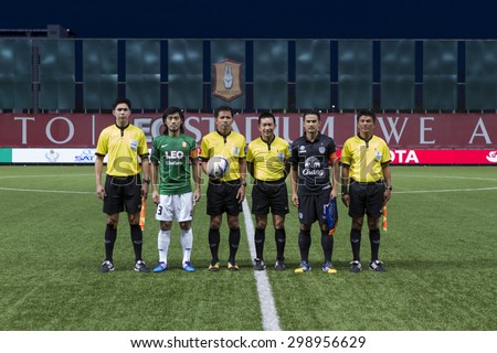 BANGKOK,THAILAND:JULY2015:The referee team captain take pictures poses during football Thailand Toyota League Cup between BANGKOK GLASS FC and BURIRAM UNITED at LEO Stadium on July 22,2015inThailand.