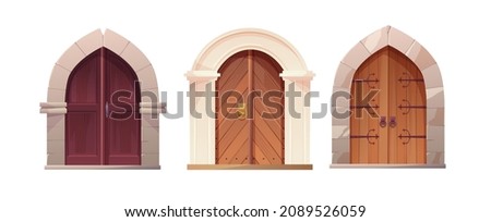 Antique medieval wooden door with metal round handle and white arch. Entrance, gate in a castle, church or house.