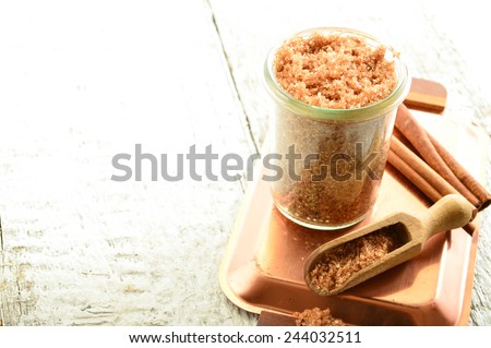 Cinnamon body scrub on a white background
