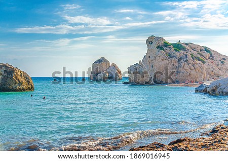 Aphrodite Beach with Stone Rocks in Aphrodite bay of Mediterranean sea water, blue sky in sunny day background, Petra tu Romiou, Cyprus Stok fotoğraf © 