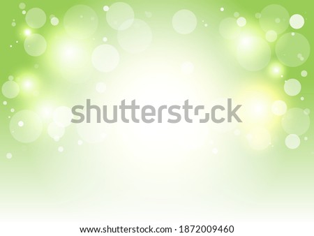 Green background with white bokeh for the environment