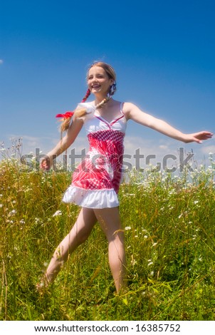 Girl enjoying summertime outdoor. Soft focus lens