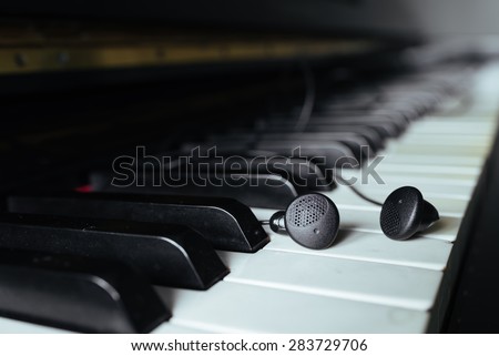 earphone on piano key