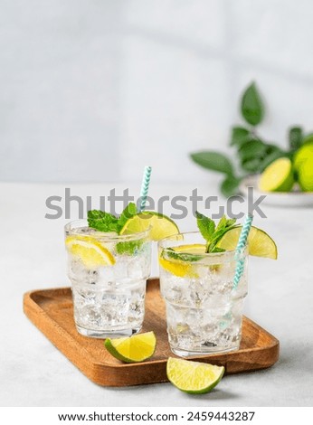 Similar – Image, Stock Photo A refreshing drink is served, with cream and chocolate powder, over a wooden table. There is also a straw for the rest in the glass.