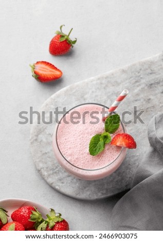 Similar – Image, Stock Photo Strawberry smoothie in a botle with pink background and pink paper straws.