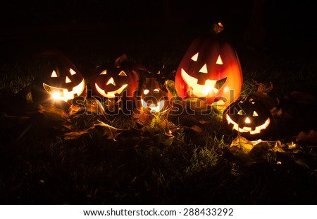 Halloween pumpkin head jack lantern with scary evil faces spooky holiday (color toned image)