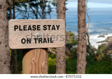 A Sign Warning that Hikers Stay on The Trail for Their Protection Along a Steep Trail at the Oregon Coast in America