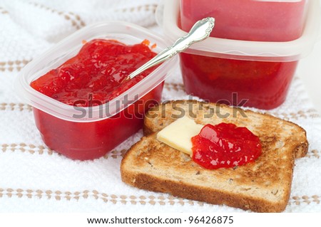 Tasty Home Made Strawberry Jam Fresh from the Garden and Served on Toast with Butter.