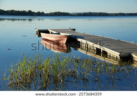 Similar – Image, Stock Photo Boat moored on lakeside in mountains