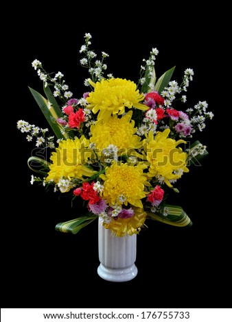 Bouquet of flower in vase isolated on black