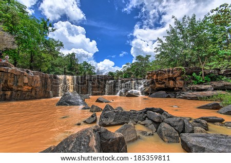 Red Waterfall and black rocks in Chaiyapoom Thailand