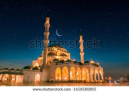 Dubai Tourism and Travel Spot Sharjah New Grand Mosque second largest mosque in Middle east, Beautiful night view of mosque with stars and moon, Amazing Islamic architecture design 